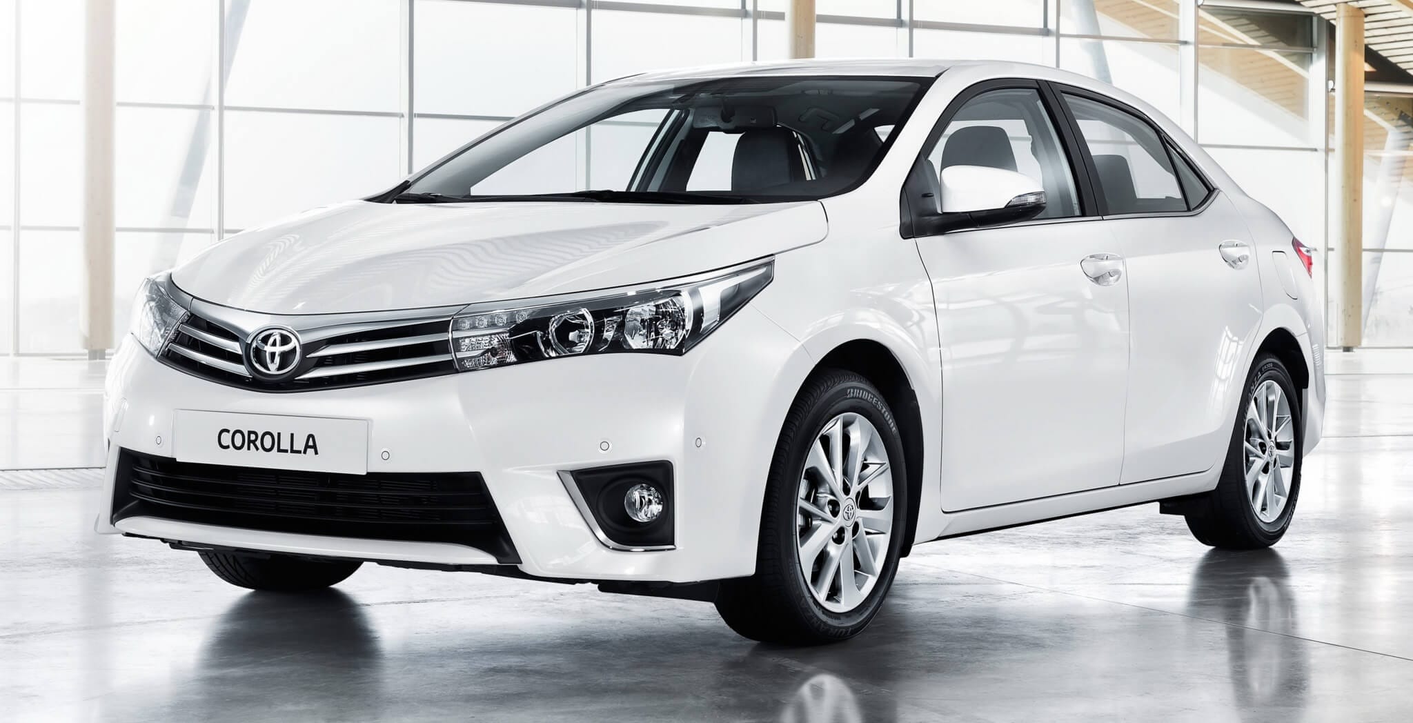 Toyota Corolla Altis plastered with dung and Jaguar XE roof covered with thatched