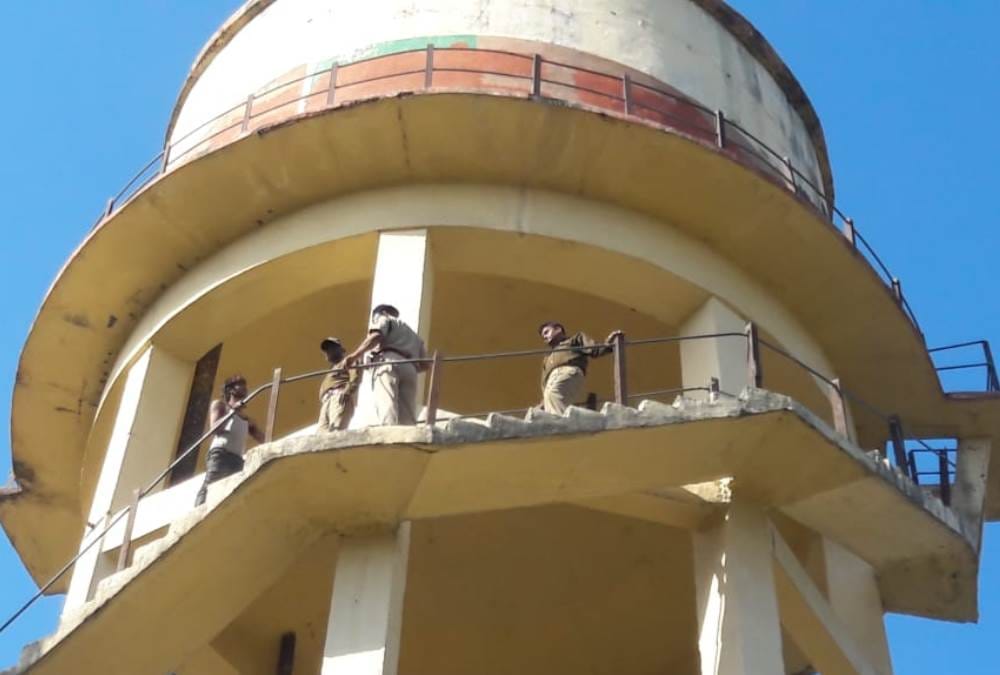 after fight with wife man climb on water tower and tries to suicide