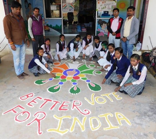 Making awareness about the voting by making Rangoli