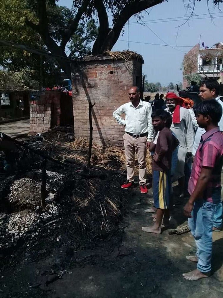 fire in huts, woman burnt