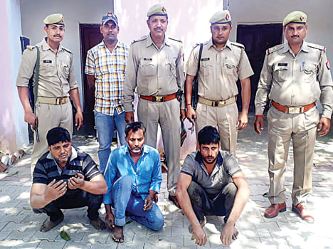 Gown-filled container caught, three arrested