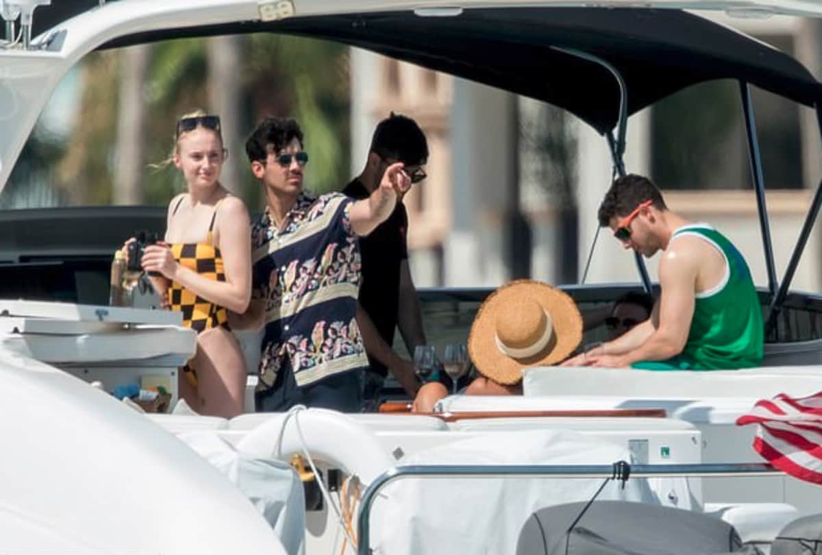 Sophie Turner chills in a plunging monokini with Priyanka Chopra and Nick Jonas