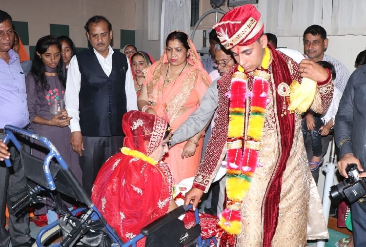 groom marriage with the bride sitting on the wheel chair in Hisar