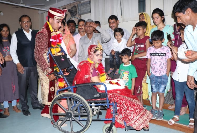 groom marriage with the bride sitting on the wheel chair in Hisar