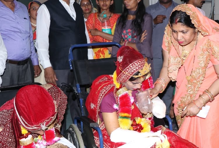 groom marriage with the bride sitting on the wheel chair in Hisar