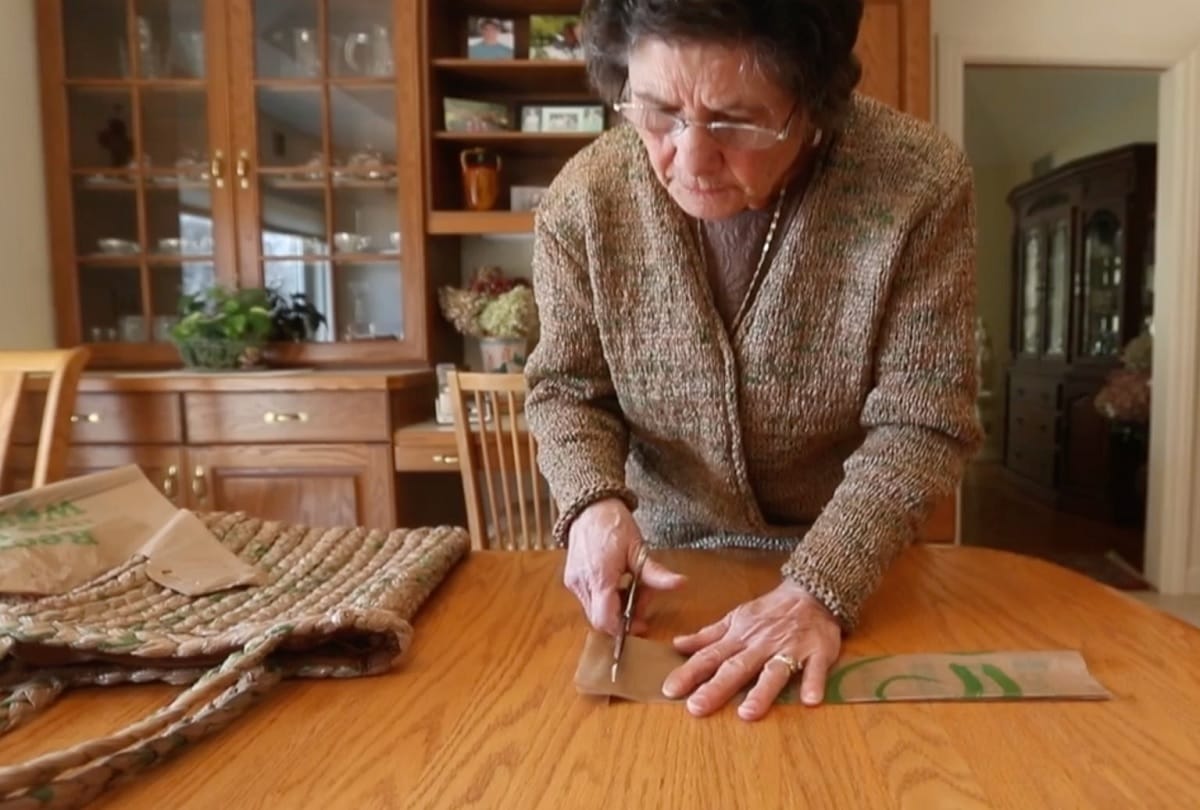 old Woman made an entire dress outfit with 300 plastic grocery bags in new york