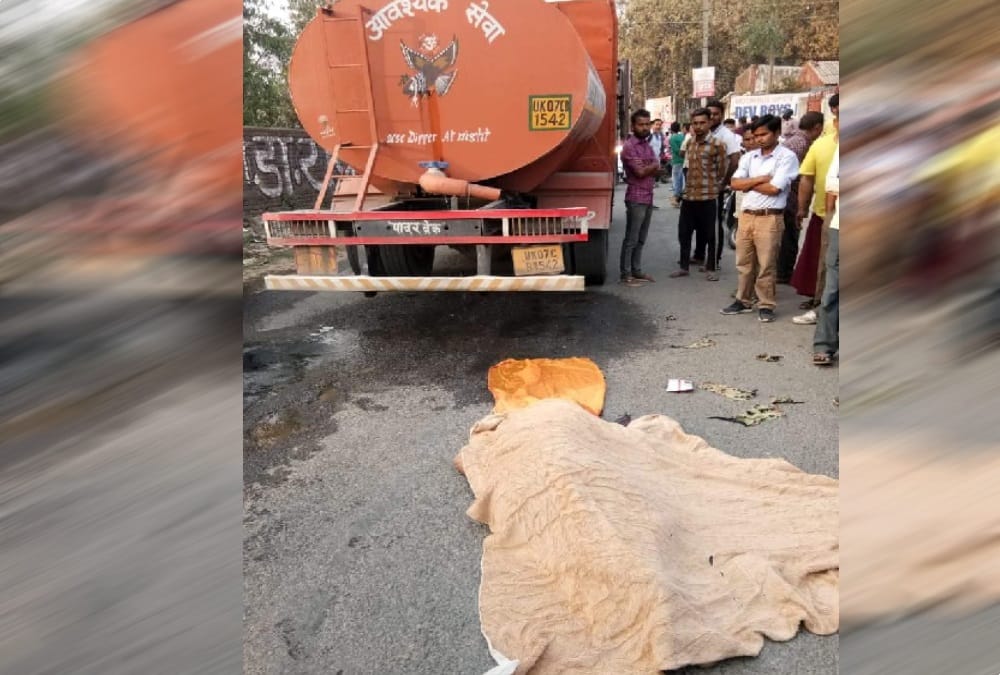 Tanker crushed boy during overtake and bike stand stuck on road in dehradun 