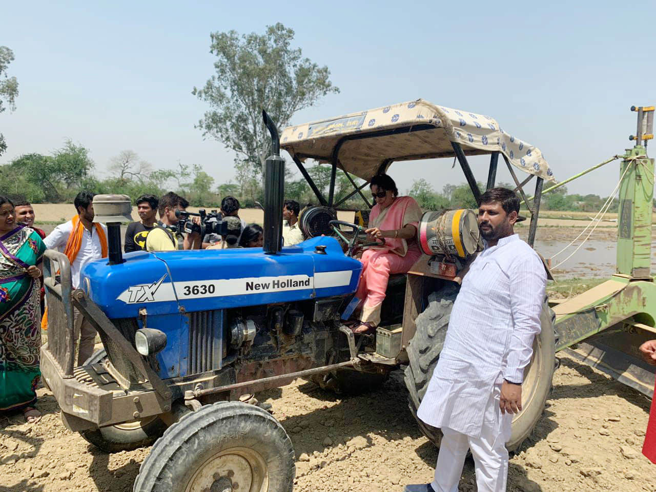 Hema Malini drive tractor in the farm after harvesting wheat crop photos viral