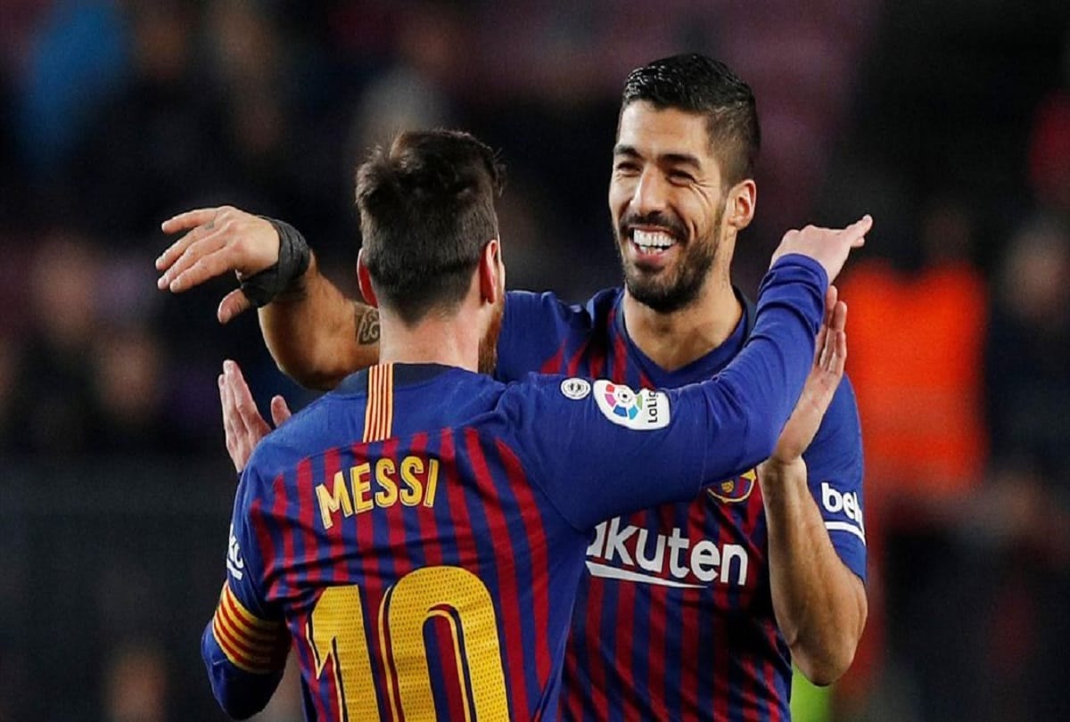 Messi and Suarez take Barcelona to verge of a title