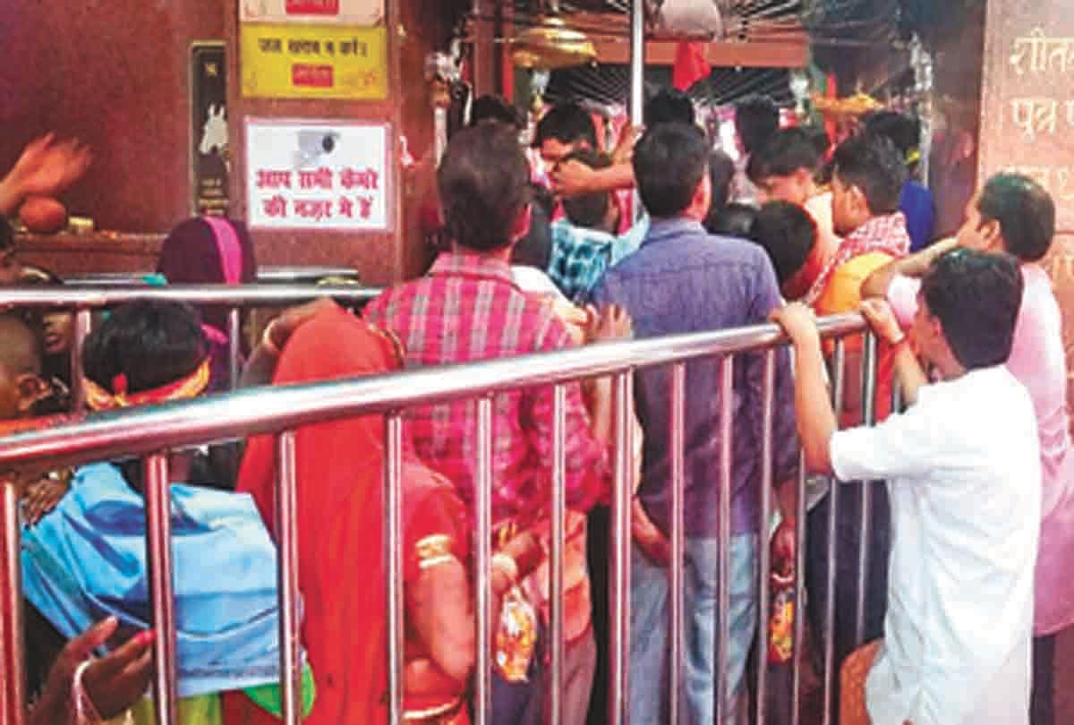 A blessing of happiness and prosperity taken from mother Chandhghanta, crowd of devotees in Bela