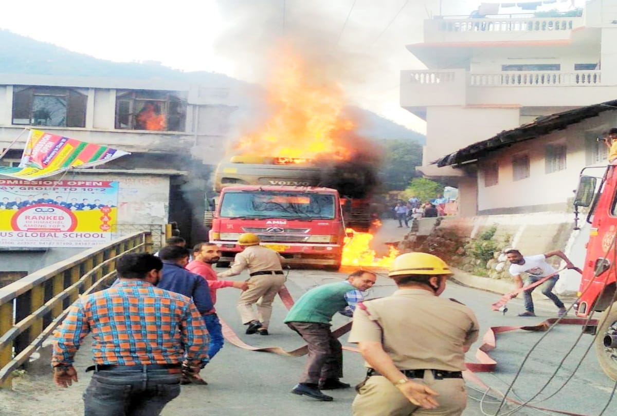 A fire in truck laden machinery after coming in the grip of electricity wire