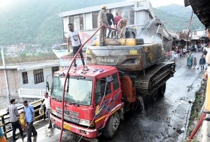 A fire in truck laden machinery after coming in the grip of electricity wire