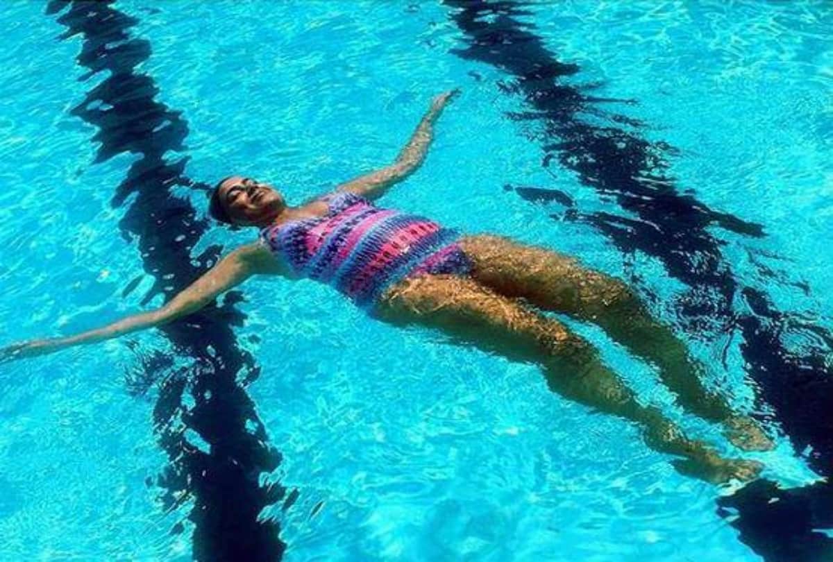 Sameera Reddy flaunts her baby bump in monokini See pictures