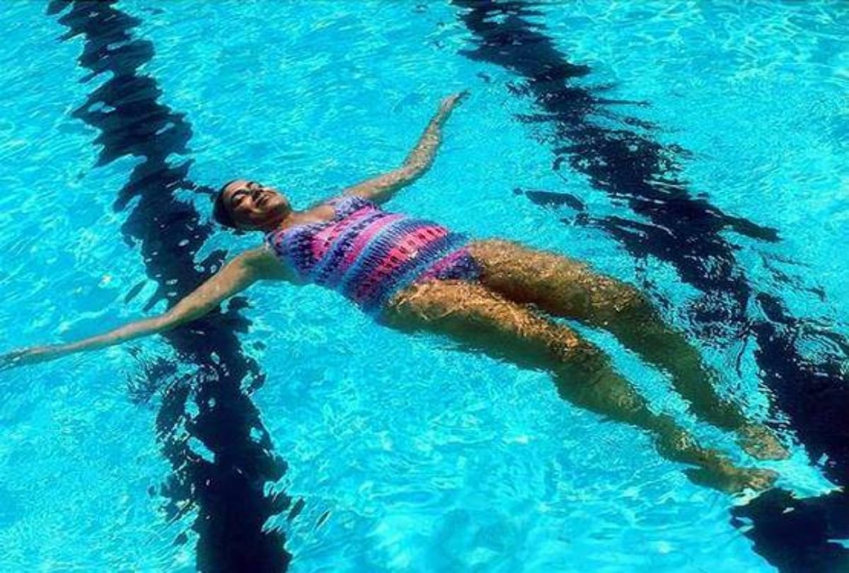 Sameera Reddy flaunts her baby bump in monokini See pictures
