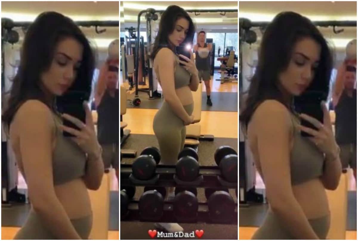 Amy Jackson flaunts her baby bump in sizzling green gown