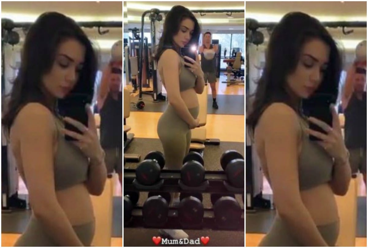 Amy Jackson flaunts her baby bump in sizzling green gown