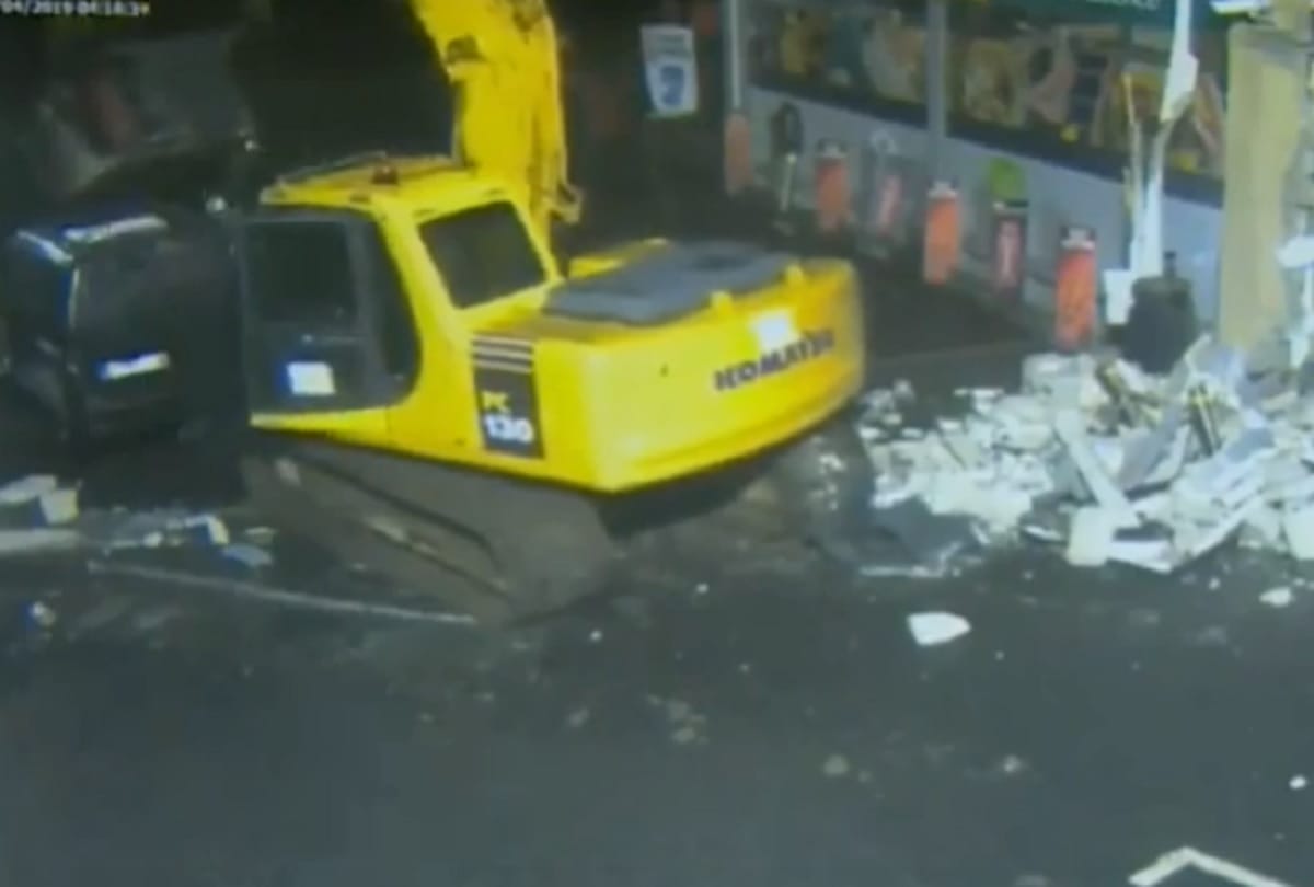 Thieves used Stolen crane to rip ATM from shop wall in Northern Ireland police releases video