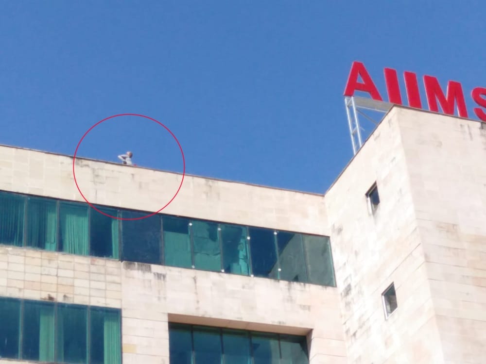Expelled old man on AIIMS rishikesh building with petrol bottle