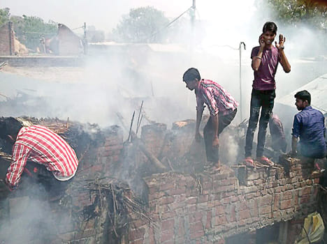 Burn farm and household goods by fire