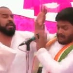 हार्दिक पटेल को मंच पर चढ़कर थप्पड़ मारता शख्स