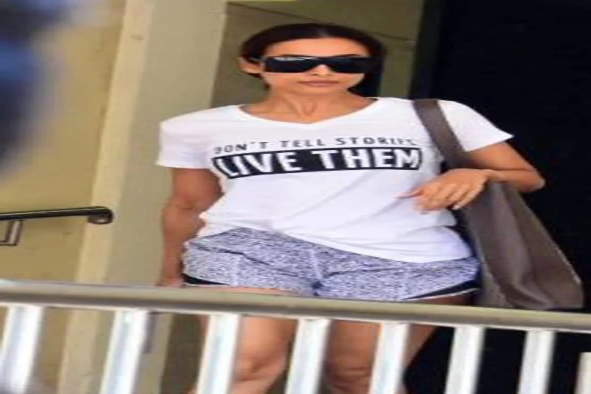 malaika arora pair t shirt shorts cool look with expensive gucci bag worth one lakh