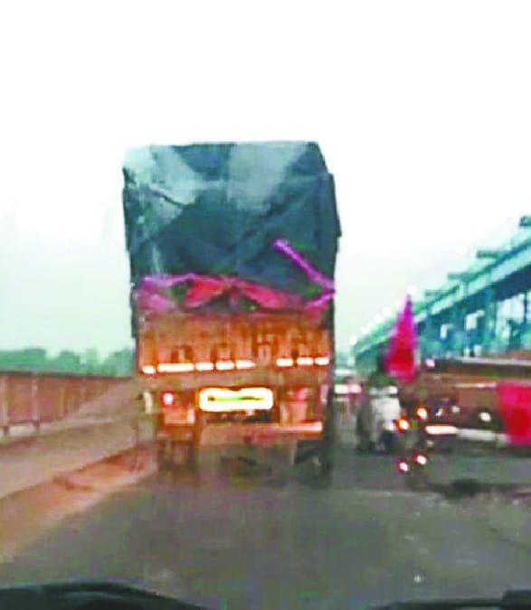 Accused of pulling overloaded vehicles from the bridge