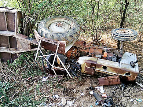 Tractor flip over brake failure, Mother died and son injured