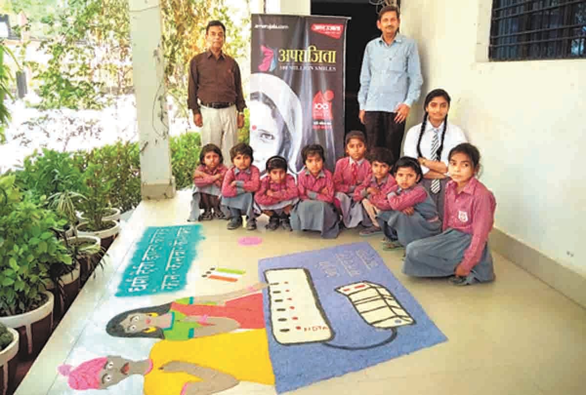 told the importance of voting by rangoli