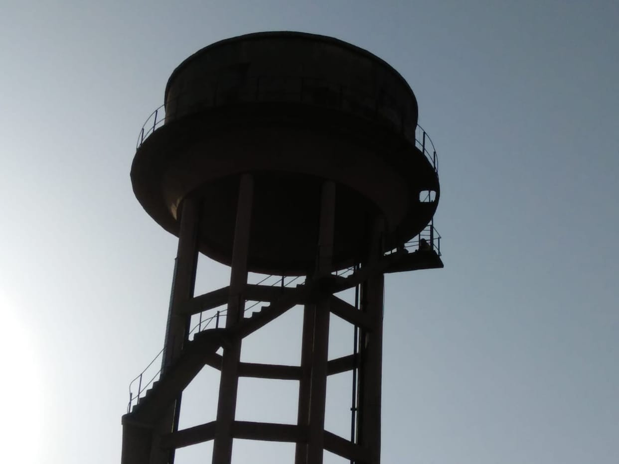 Expelled women worker of AIIMS rishikesh climb on water tank