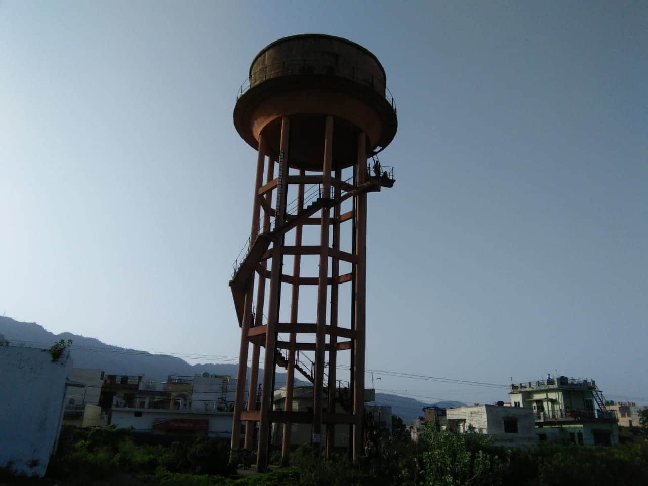 Expelled women worker of AIIMS rishikesh climb on water tank