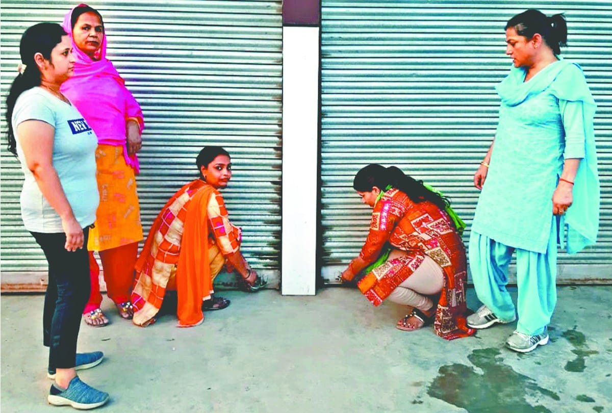 Women protest over wine shop in front of Society
