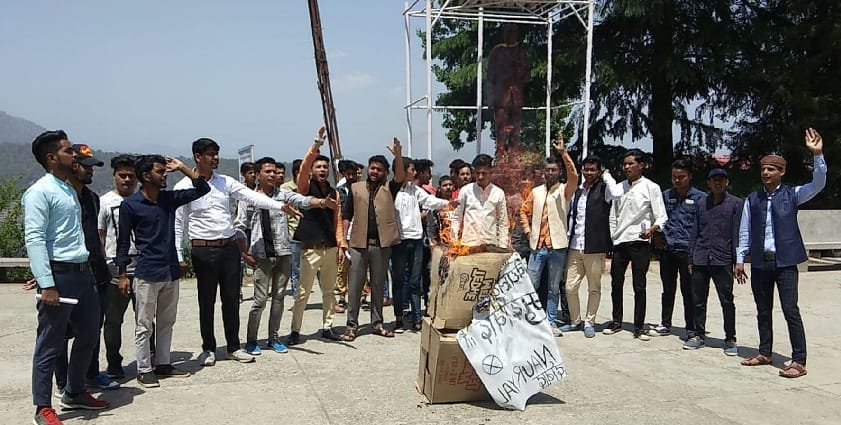 Students blow the effigy of Vice Chancellor and Controller of Examinations
