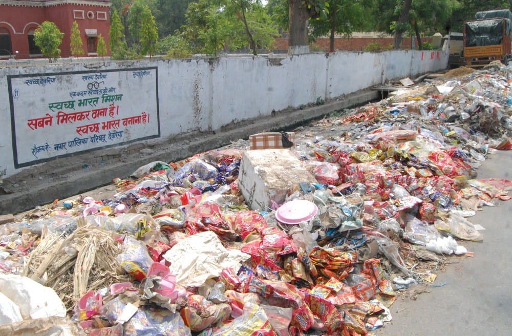 heaps of rubbish in c=ity