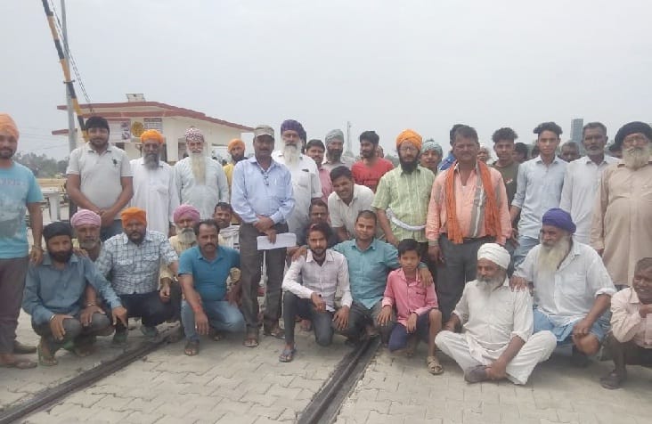 On closing the railway gate, sitting on the rural track, performing
