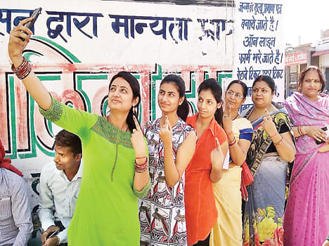 Voter turnout in strong sun, 55.99 percent polling