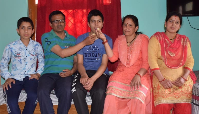 Jitendra Lohani made the district topper by bringing 99 percent marks