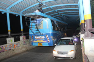 bus tugged in underbridge