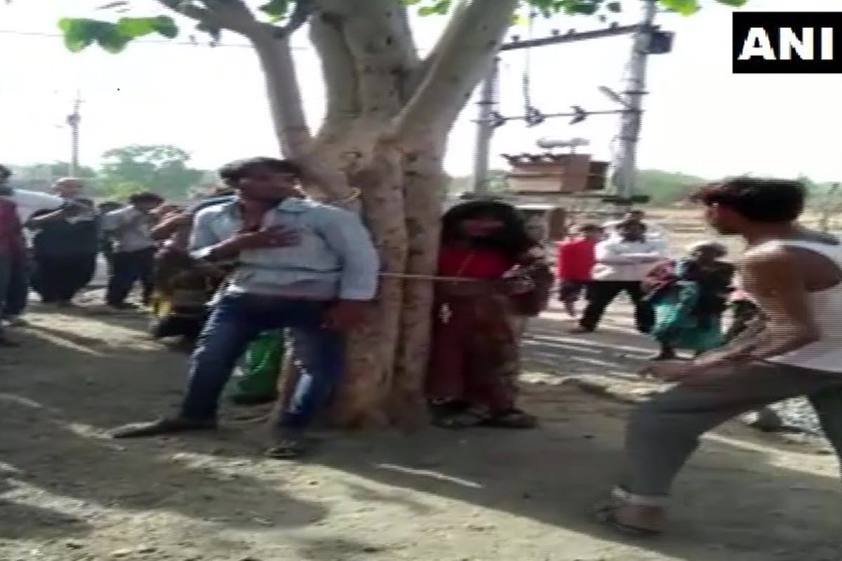 man and his two relatives tied to tree and beaten up after he allegedly eloped with married woman