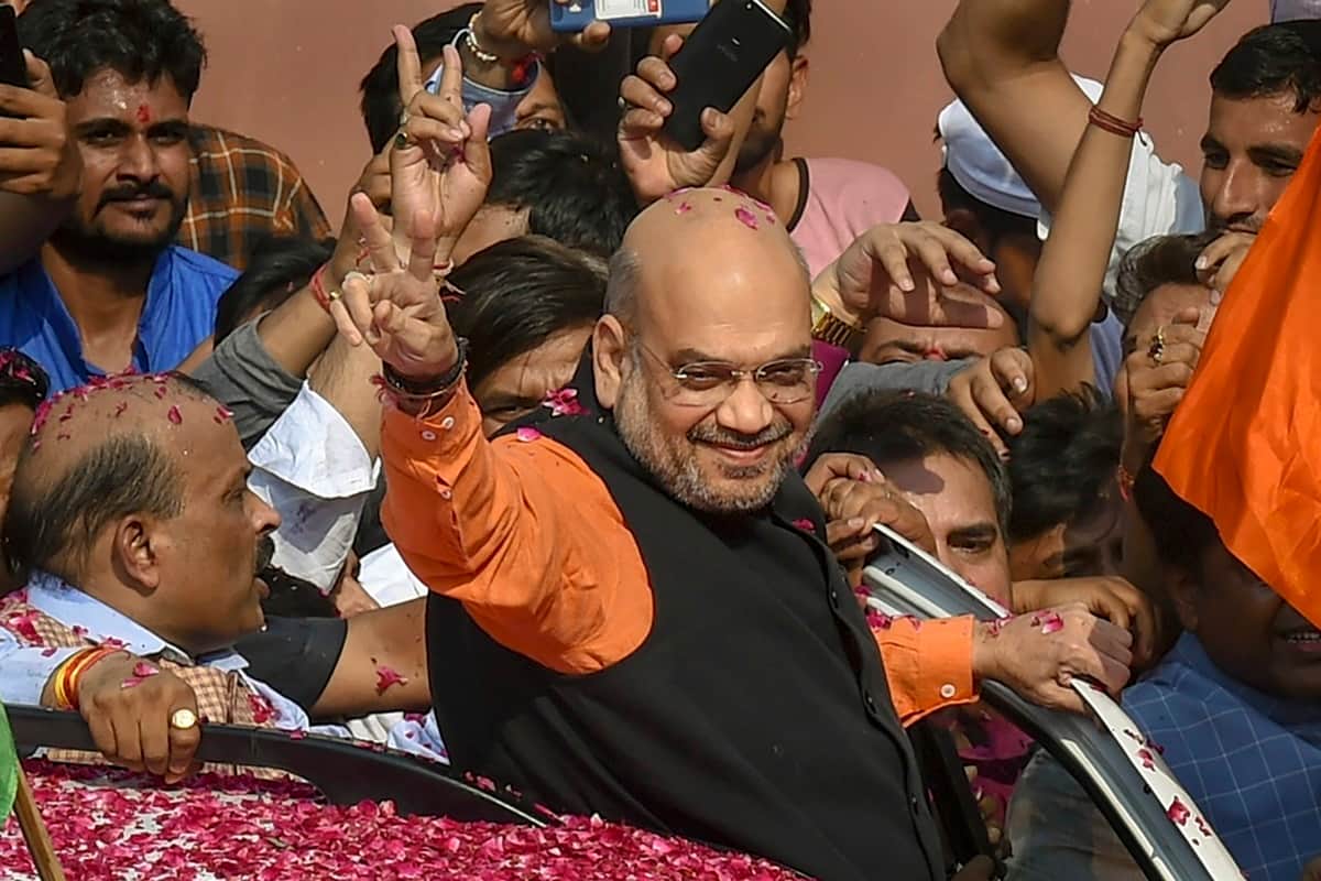 amit shah will be cabinet minister in modi government, has been charge of 12 ministries in Gujarat