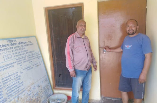 Villagers lock locks in the office of Water Institute