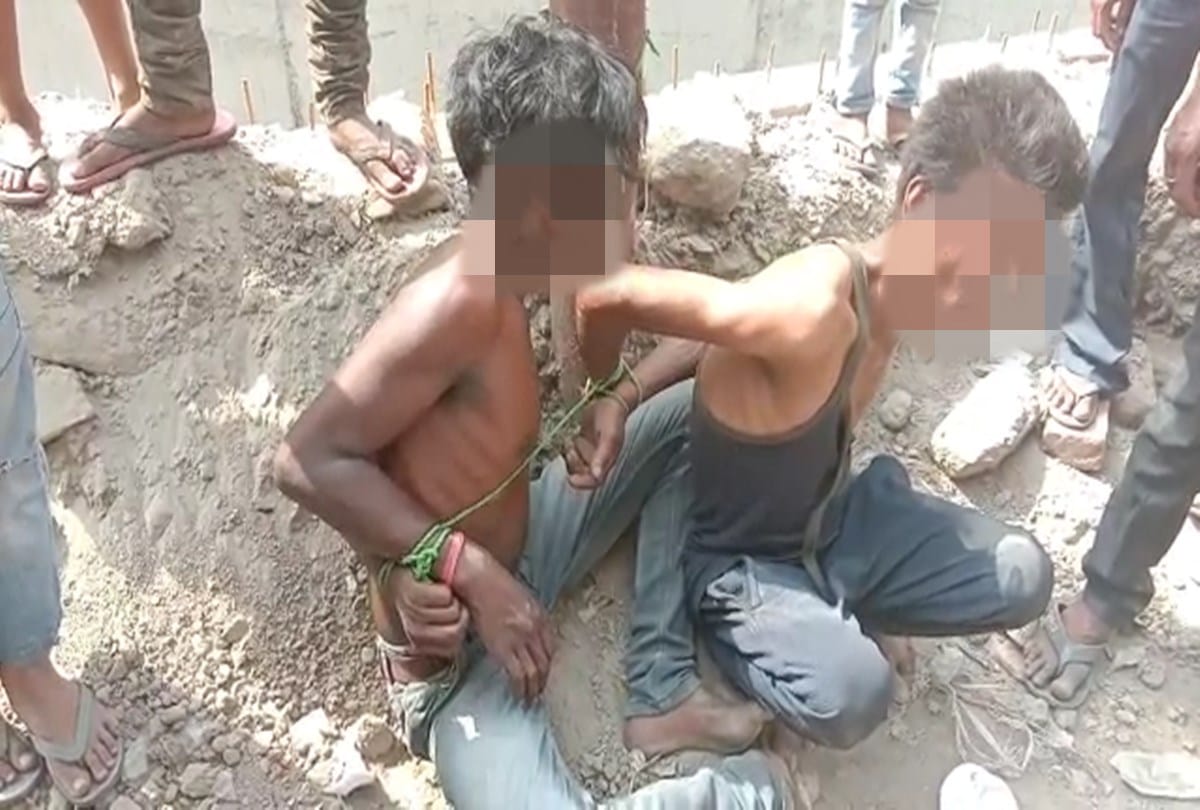 Two youth beaten tied to piller by people in Noida