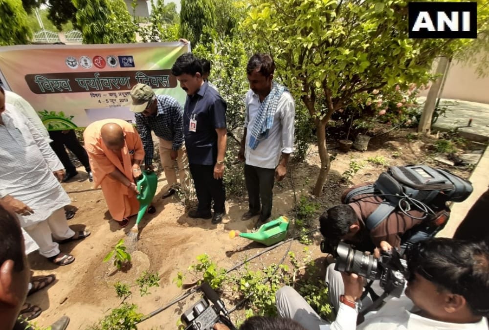 Yogi Adityanath plants a sapling in his resident on world environment day.
