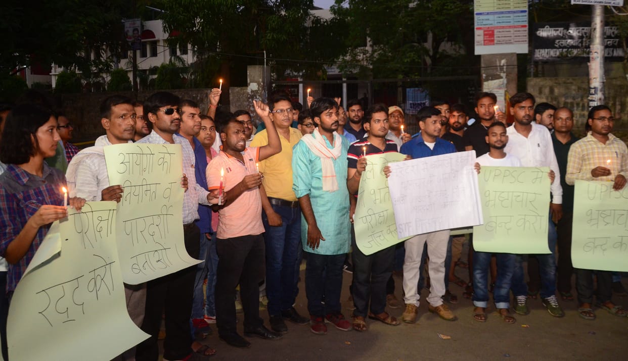 Students marched with candles demanding to cancel LT grade exam.