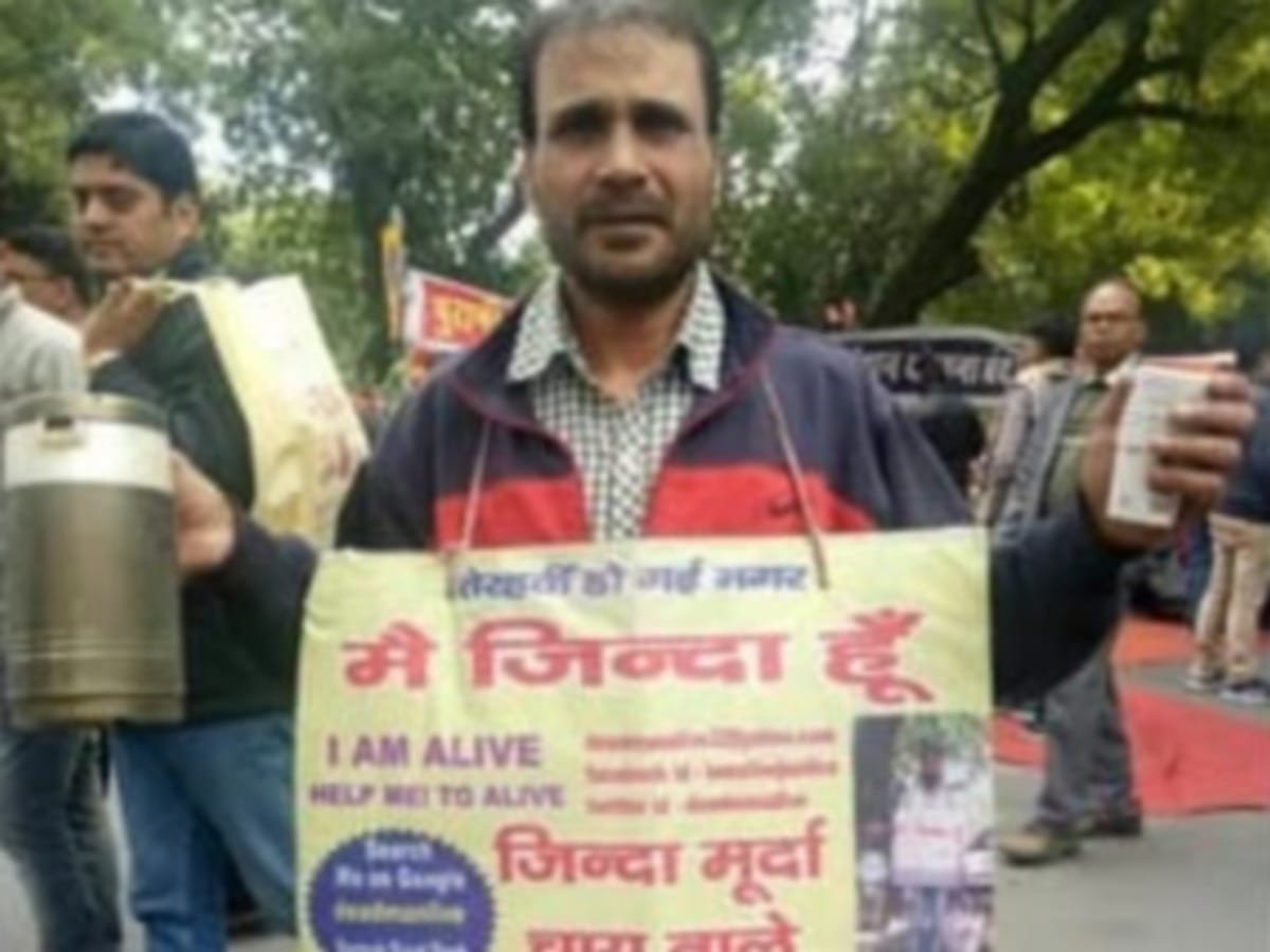 Santosh Murat, who roamed around hanging the board of 'I am alive' around his neck, said