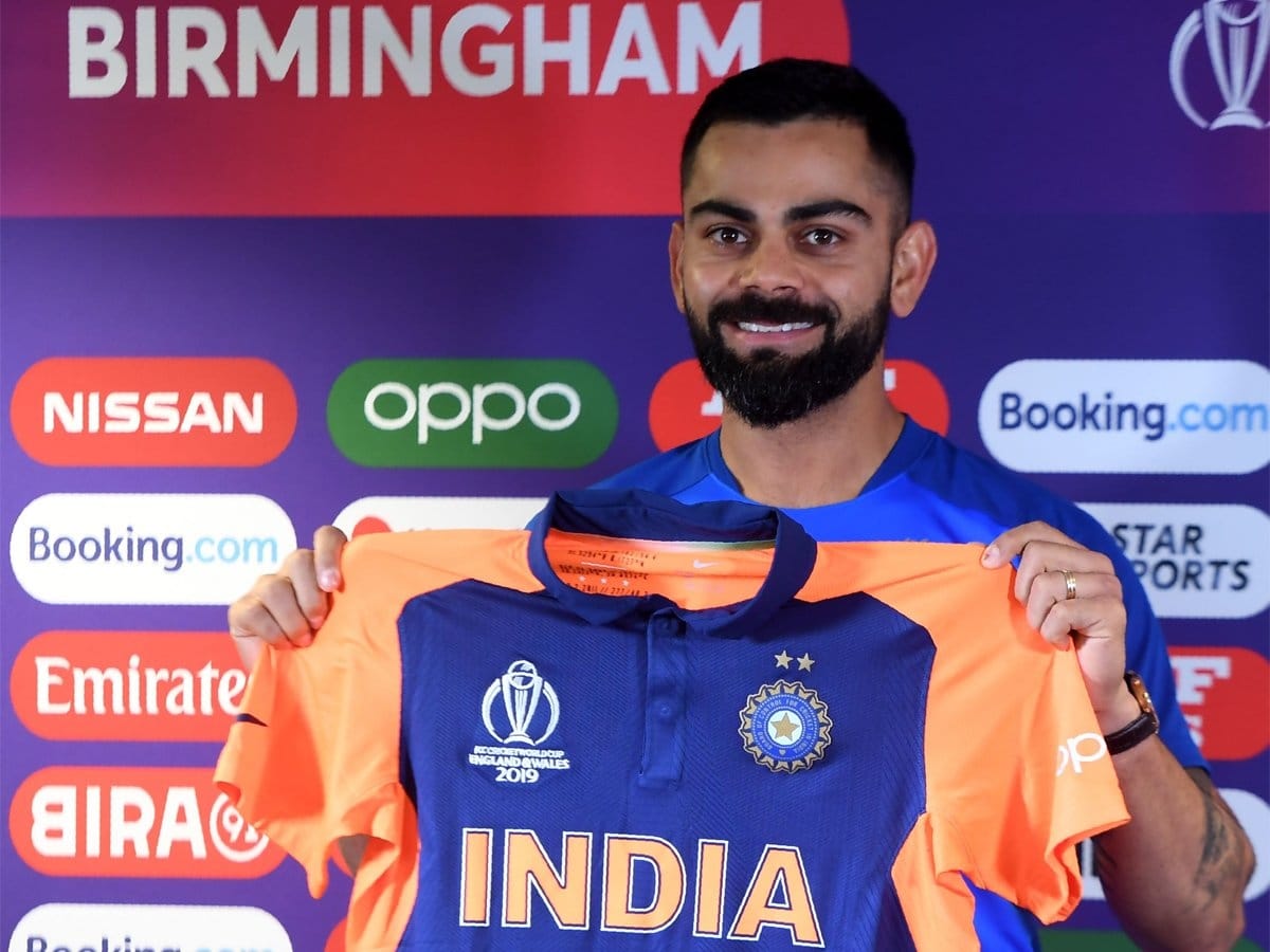 Virat Kohli unveils new Orange India jersey against England in world cup 2019
