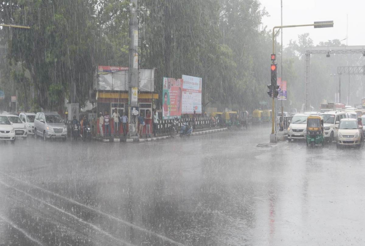 a girl opens her umbrella to save a rickshaw puller from rain
