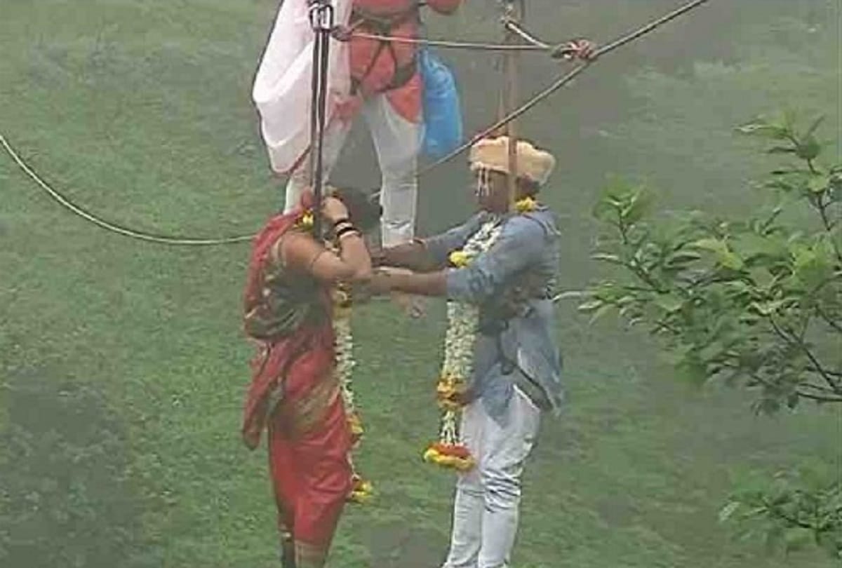 Weird marriages in the world Someone hanging in the air and someone got married inside the water