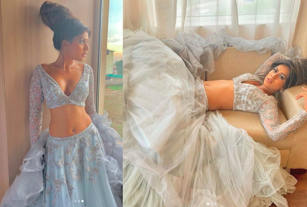 nia sharma stunning look in white lehenga during fashion show in dehradun