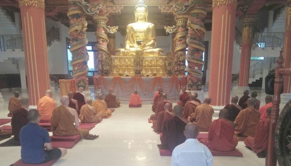 Buddhist followers engaged in ritual worship