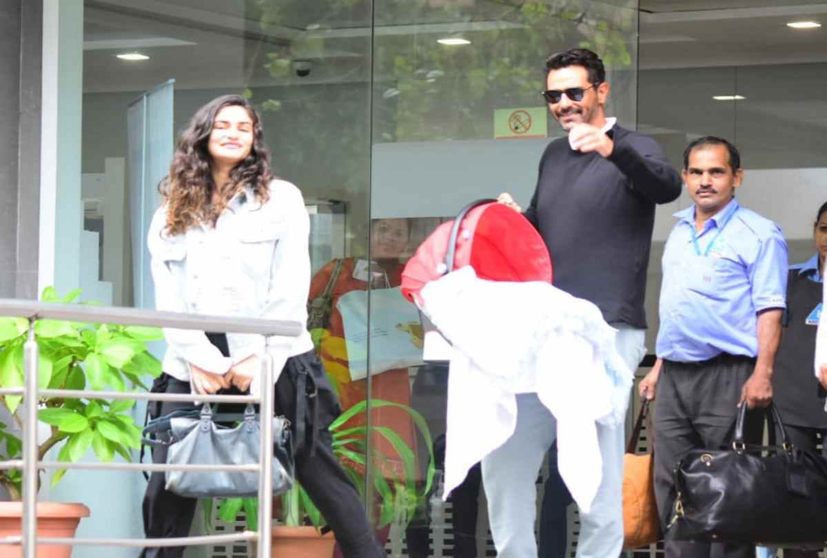 arjun rampal and gabriella demetriades take their baby boy home pose with media